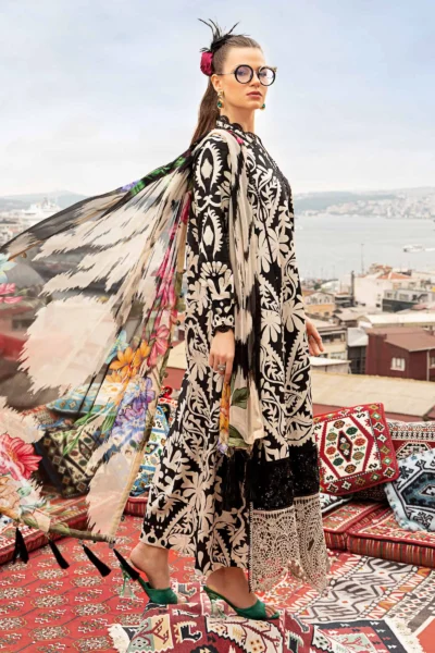 Side view Model wearing Maria B. MPT-2307-B 3-piece black cambric suit with embroidered lace and chiffon dupatta